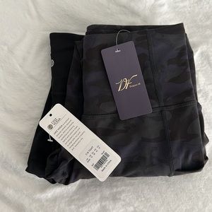 Two pair of workout leggings with tags on